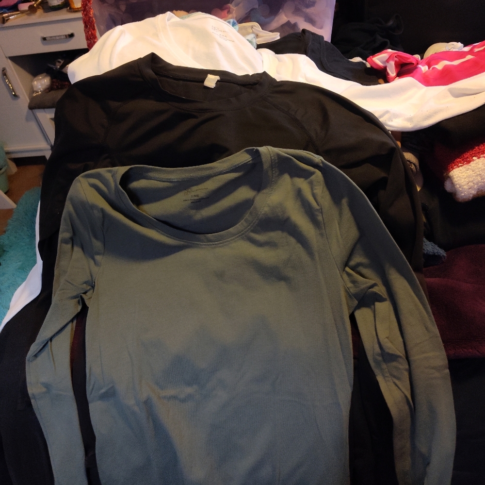 Three small sized long sleeved undershirts